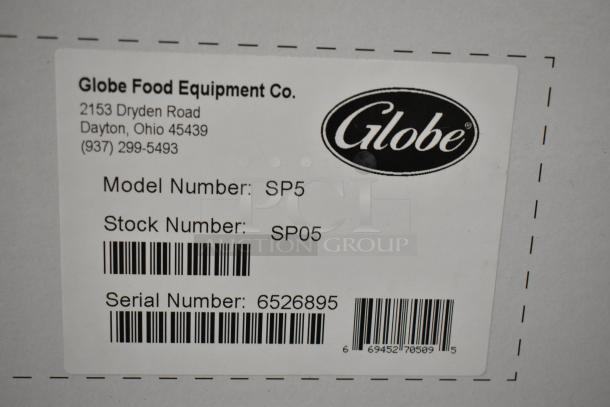 Brand new Globe SP05 5 Quart Planetary Dough Mixer, 115V, with label showing model, stock, and serial numbers.