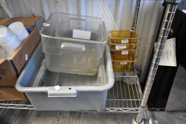 Lot of various poly drop-in bins and containers in good condition, stacked on a metal shelf; no shelving unit included.