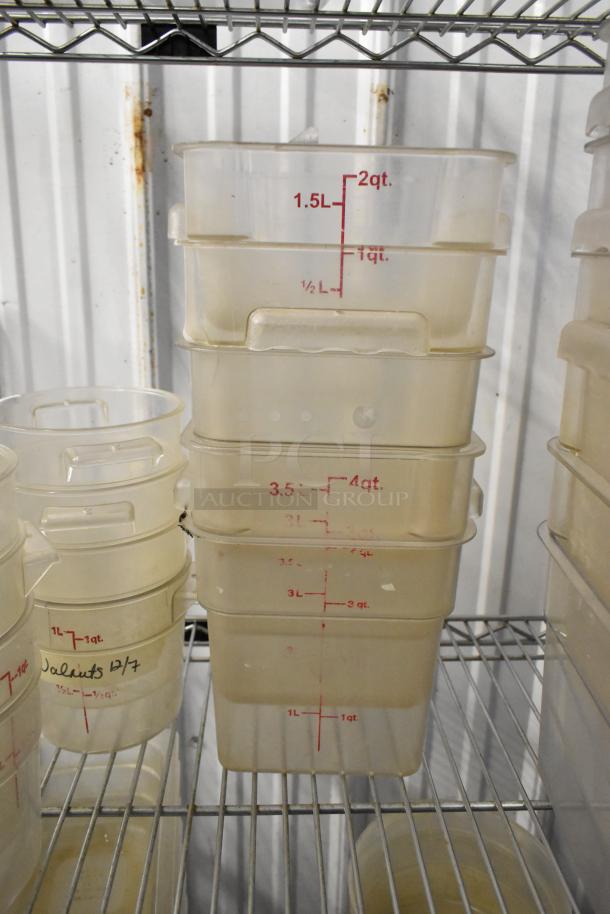 Various poly drop-in bins and containers stacked on shelving, marked with measurements in liters and quarts. Shelving not included.