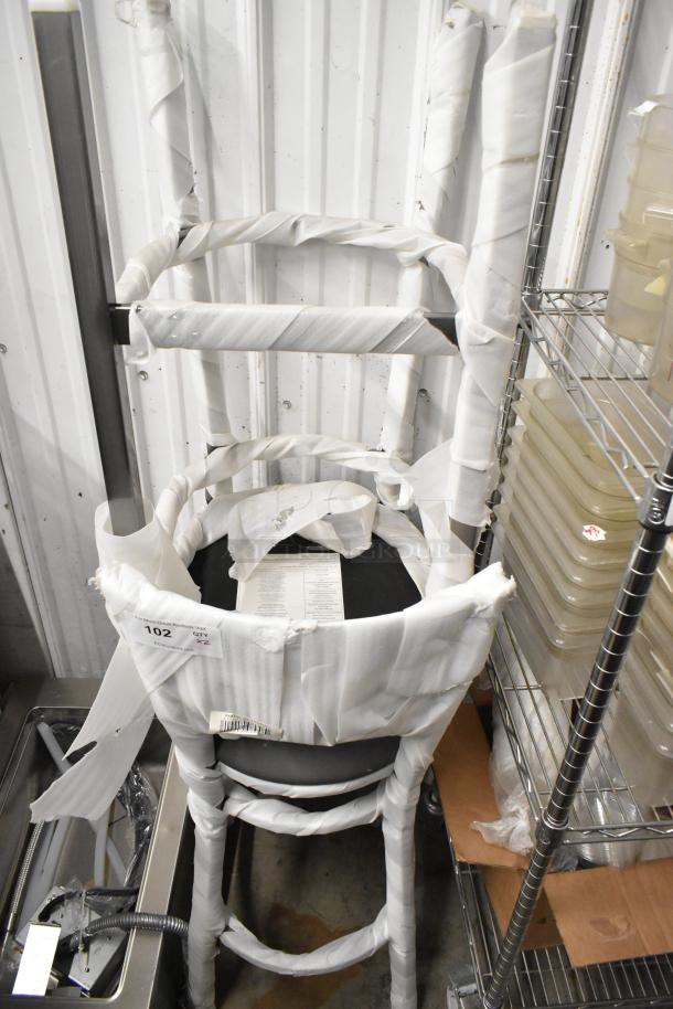 Brand new Lancaster Table & Seating gray metal crossback bar height chair, wrapped. Scratch and dent condition, quantity 2.