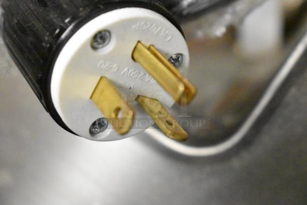 Close-up of a plug on a NEW ServIt 423SDW1H stainless steel hot food well, 208/240V, 1 Phase, showing connections.