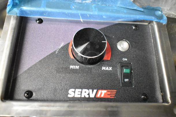 Stainless steel control panel of ServIt 423SDW1H hot food well with temperature knob and on/off switch.