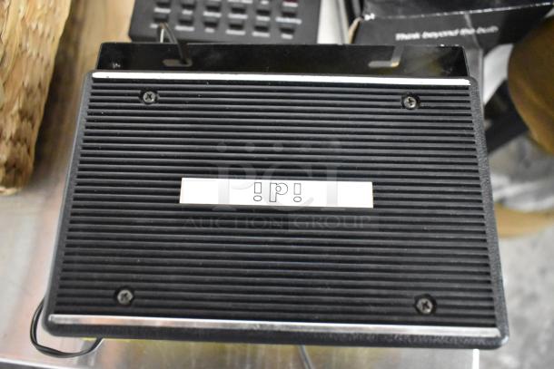 Heavy-duty extension speaker, black ridged surface, two screws visible, labeled "!p!". Used condition.