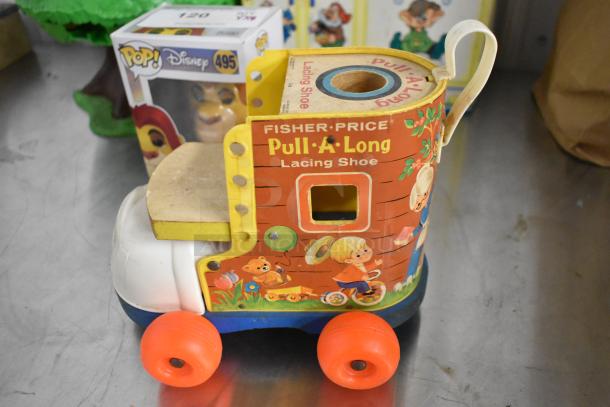 Fisher Price Pull A Long Lacing Shoe with colorful graphics, red wheels; includes Mufasa Funko Pop and tree toy.