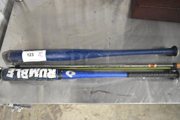 Four assorted items including two baseball bats and two golf clubs, featuring visible wear. Item tag reads "123, QTY 4X".