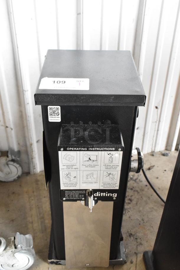 2022 Hemro KR1203 commercial coffee grinder, black metal, countertop model. Features 120 volts, 1 phase, with operating instructions visible.