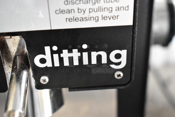 2022 Hemro KR1203 commercial coffee grinder, 120 volts, 1 phase, with "ditting" branding on metal body, signs of use.