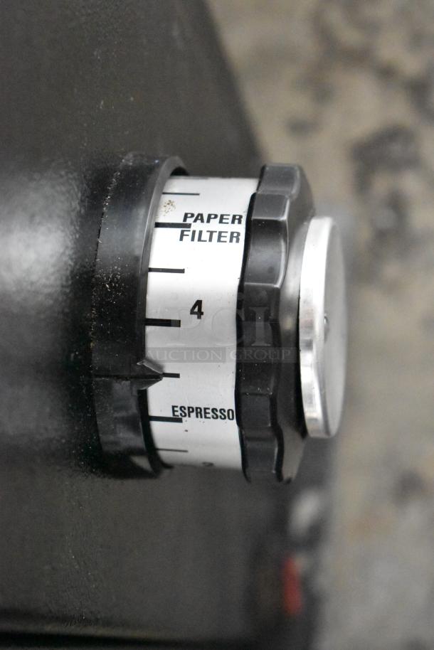 2022 Hemro KR1203 commercial coffee grinder, showing grind size dial with paper filter and espresso settings, metal body.