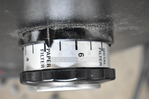 2022 Hemro KR1203 coffee grinder dial showing "Paper Filter" and "Metal Filter" settings, indicating grind adjustment.