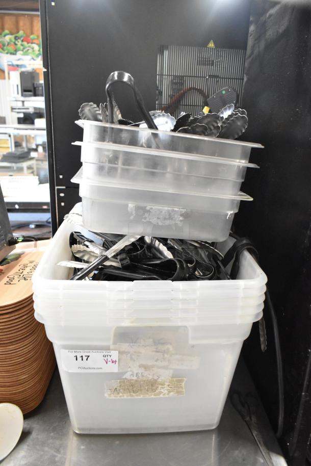 Lot of various items including stacked poly bins filled with utensils; auction label "117" visible.