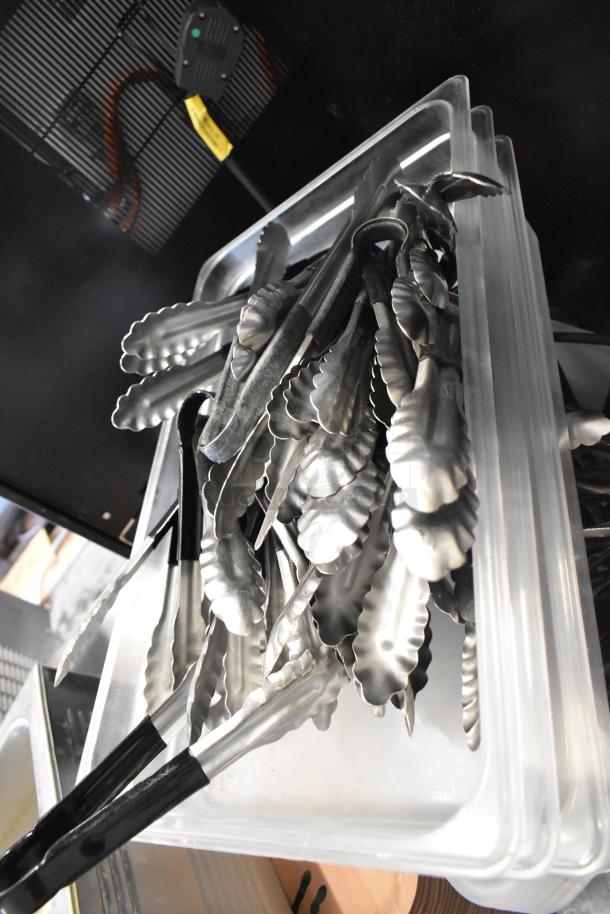 Lot of various items including stacked poly bins and metal utensils, likely kitchen tongs, in used condition.