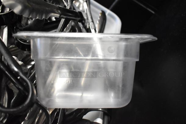 Lot of various kitchen items including poly bins and utensils, featuring plastic storage bin and metal tongs, in used condition.