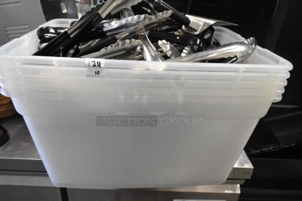 Lot of various items including plastic poly bins filled with metal utensils, such as tongs. Label reads "12.4 10." indicating quantity or size.