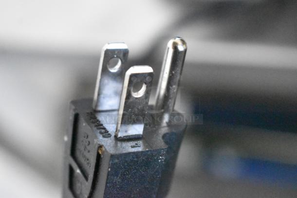 Close-up of a standard power plug for the Carnival King 382RWS35 stainless steel commercial countertop warmer.