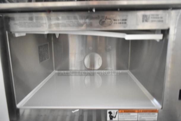 BRAND NEW SCRATCH AND DENT! 2025 Amana HDC12A2 Heavy Duty Stainless Steel Commercial Microwave interior with push button controls.