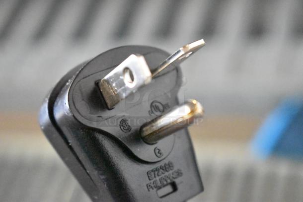 Plug detail of brand new Amana HDC12A2 heavy-duty commercial microwave, 120 volts, 1 phase.