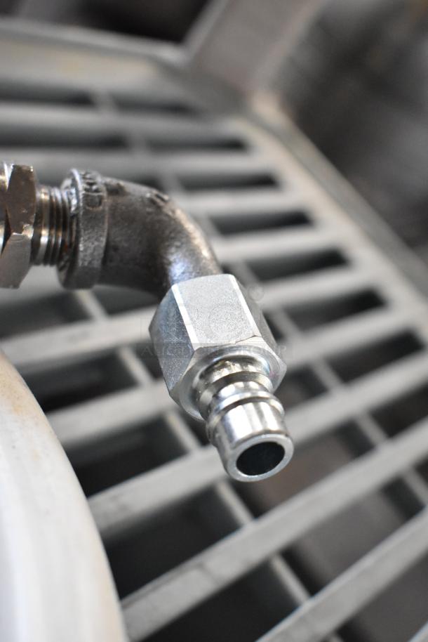 Hose assembly for oil filter with metal fittings and an L-shaped connector, in excellent condition.