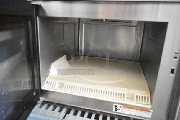 Brand new Solwave SWA21T stainless steel commercial microwave oven, 208/240V, scratch and dent, visible interior details.