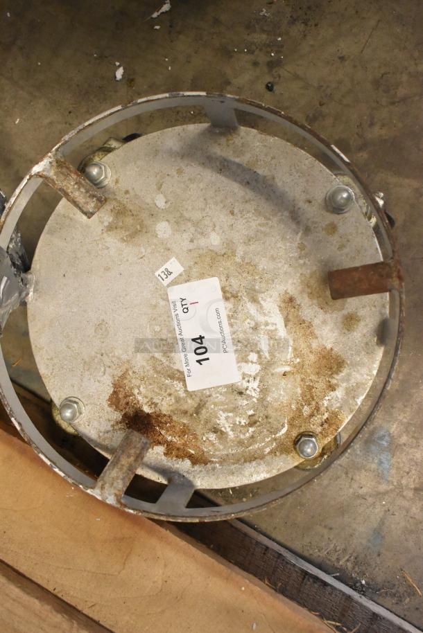 Metal bowl dolly with commercial casters, showing some rust and wear. Label indicates "Lot 104, Qty 1".