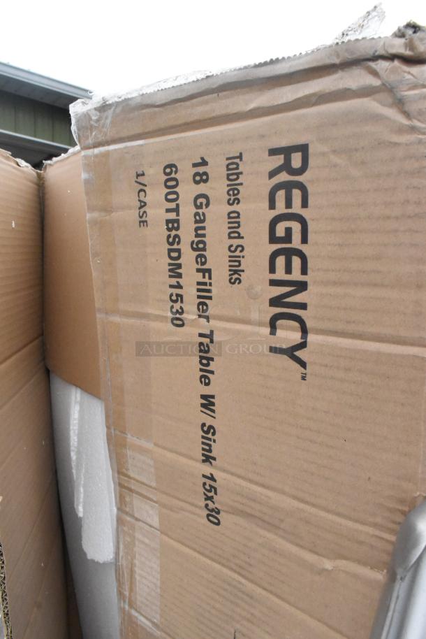 Box labeled "Regency 18 Gauge Filler Table With Sink," indicating scratch and dent condition, part of a 6-item auction lot.