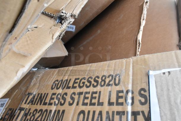 Box of new scratch and dent items, including stainless steel legs labeled "600LEGSS820," part of a bulk lot.