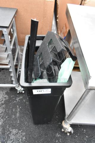 Black Slim Jim trash can with lid organizer, in fair condition, includes contents. Auction label visible.