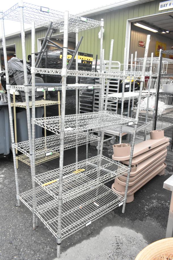 Chrome finish 4-tier wire shelving unit in good condition. Buyer must dismantle. Consider freight charges.