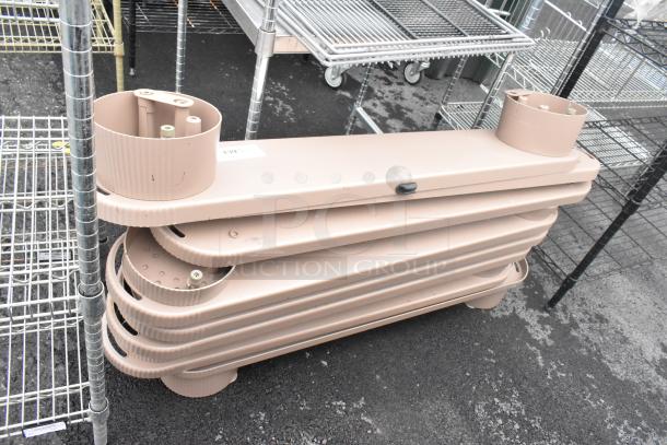 Eight light brown floor units stacked, featuring rounded edges and durable construction. Auction includes all units.