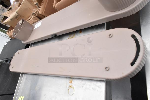 Light brown unit with smooth, elongated design, visible mounting holes, minor surface marks, in good condition. Eight available.