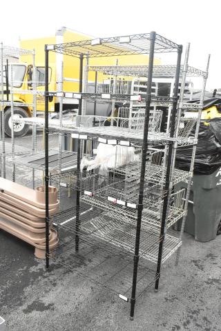 Black finish 6-tier wire shelving unit, good condition, requires buyer dismantling. Consider freight shipping charges.
