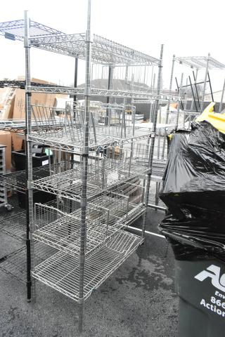Chrome finish 6-tier wire shelving unit in good condition, needs dismantling by buyer; ideal for storage, freight charges apply.