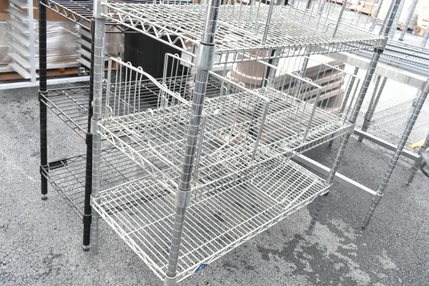 Chrome finish 6-tier wire shelving unit in good condition. Buyer must dismantle; consider freight charges.