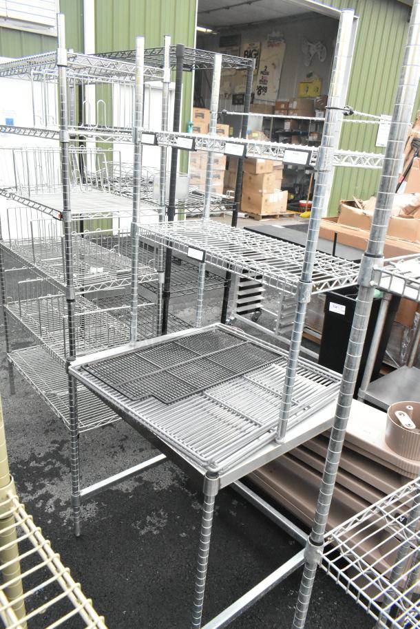 Metal table with 2-tier wire shelf, sturdy construction, ideal for storage, features wire mesh design, good condition.
