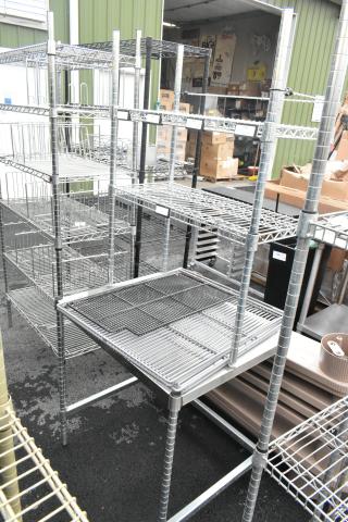 Metal table with 2-tier wire shelf, sturdy construction, ideal for storage, features wire mesh design, good condition.