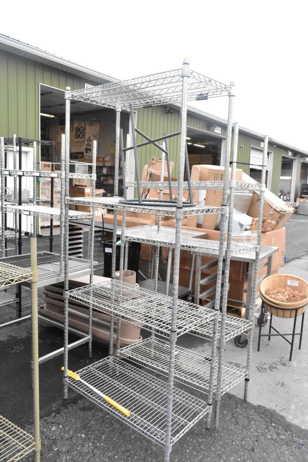 Chrome finish 4-tier wire shelving unit, sturdy condition, industrial setting. Buyer must dismantle. Freight charges apply.