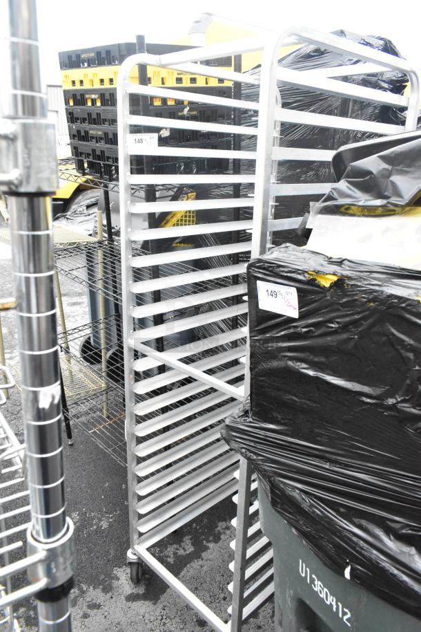Metal commercial pan transport rack on casters, 20 slots. Sturdy aluminum frame, in good condition. Ideal for kitchen use.