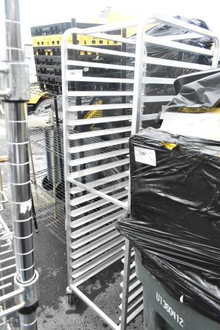 Metal commercial pan transport rack on casters, 20 slots. Sturdy aluminum frame, in good condition. Ideal for kitchen use.