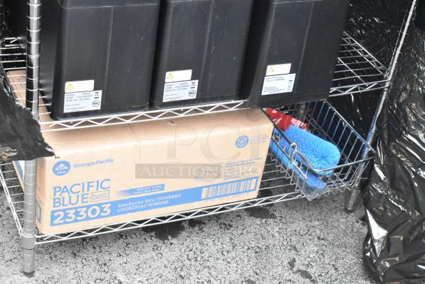 Chrome finish 3-tier wire shelving unit with contents, including lid organizer. Features blue brush, Georgia-Pacific box.