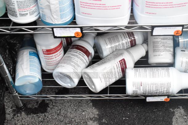 Chrome finish 6-tier wire shelving unit with various cleaning supplies including lotion hand soap and microfiber duster refill.