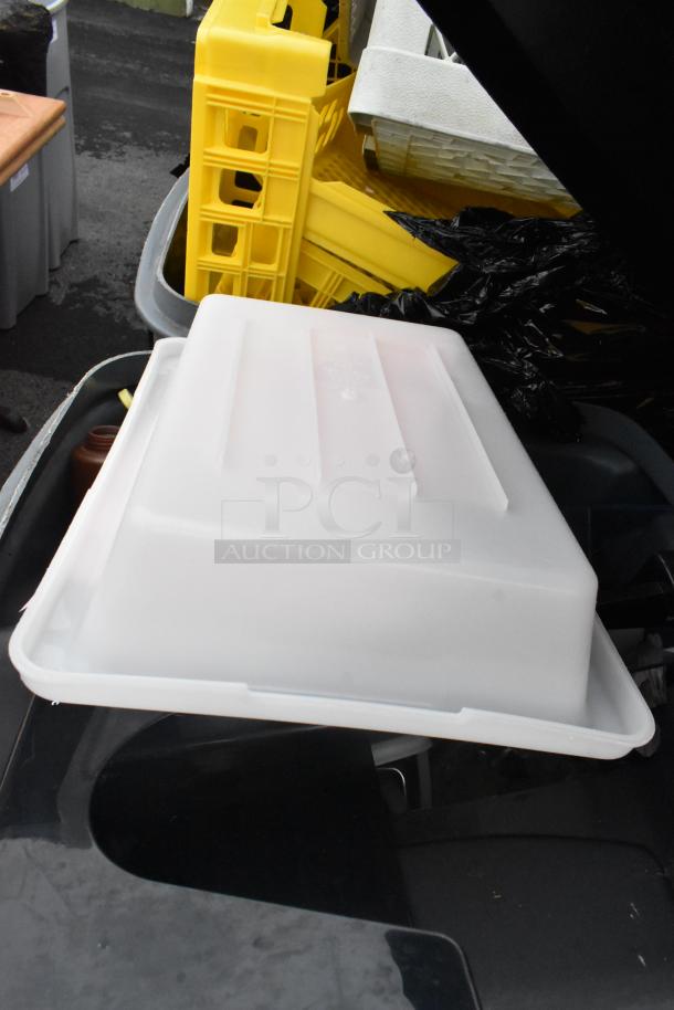 Rubbermaid gray poly trash can with contents, including a poly bin. Features durable construction, good condition.