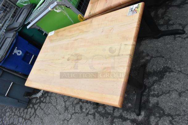 Wood pattern dining table with black metal legs, showing some wear. Comes in a set of 6. Labels visible.