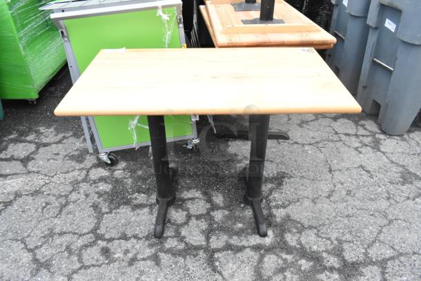 Dining table with wood-patterned top, black metal straight legs. Good condition. Auction includes 6 tables total.