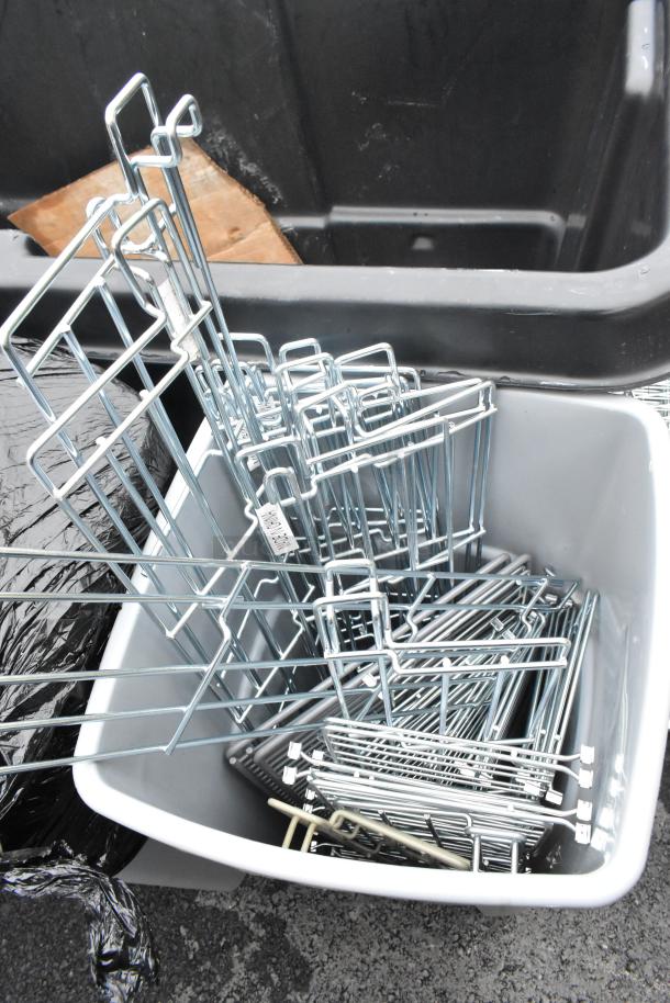 Poly trash can with assorted wire bumpers for shelves. Bumpers are metal and nested inside the gray can, all in used condition.