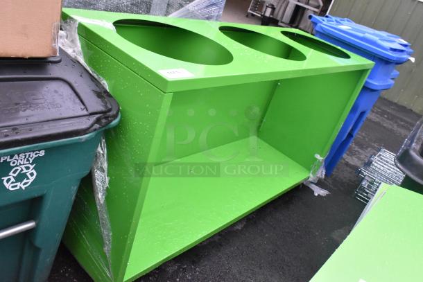 Green counter with three circular cutouts and an under shelf, in good condition.