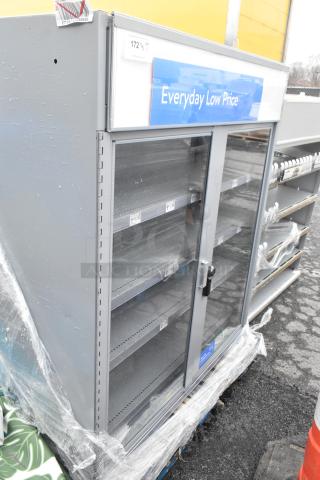 Gray metal 2-door cabinet with metal shelves and locked doors. Includes label reading "Everyday Low Price" and signs of outdoor exposure.