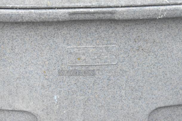 Gray poly trash can shell, textured surface. Label: "Toters." Signs of wear visible. Auction includes 2 shells.