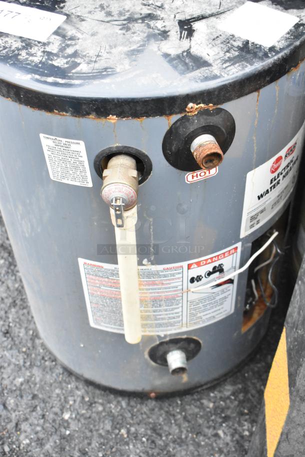 2016 Rheem Rudd EGSP15 Electric Water Heater, 120V, 1 Phase, visible rust and wear, label indicates model and warnings.
