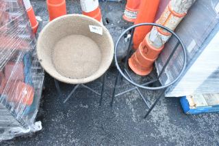 Two black metal stands with a woven basket on one. Includes auction tag "183" indicating quantity of 2.