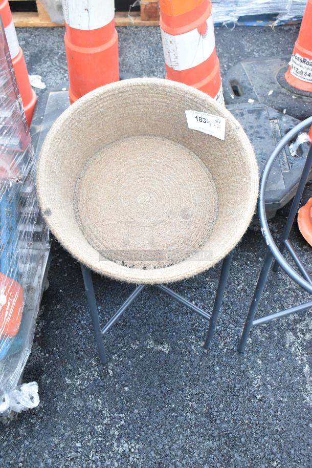 Two black metal stands with a woven basket, excellent condition, tag indicates item number 183 and quantity 2.