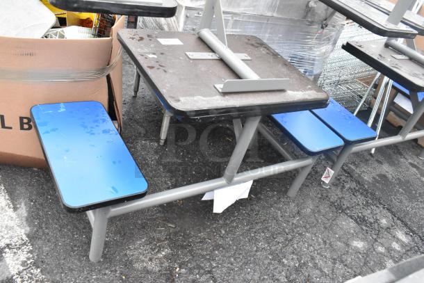 4 metal tables with 2 bench seats each, gray frames, blue benches, some wear visible, sold as 4 sets per bid.